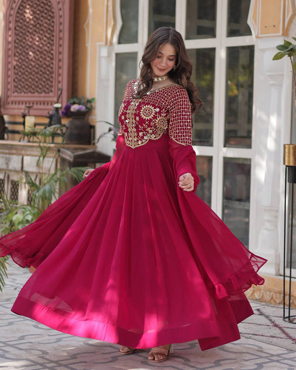 Rani pink color faux blooming georgette gown with embroidered dupatta