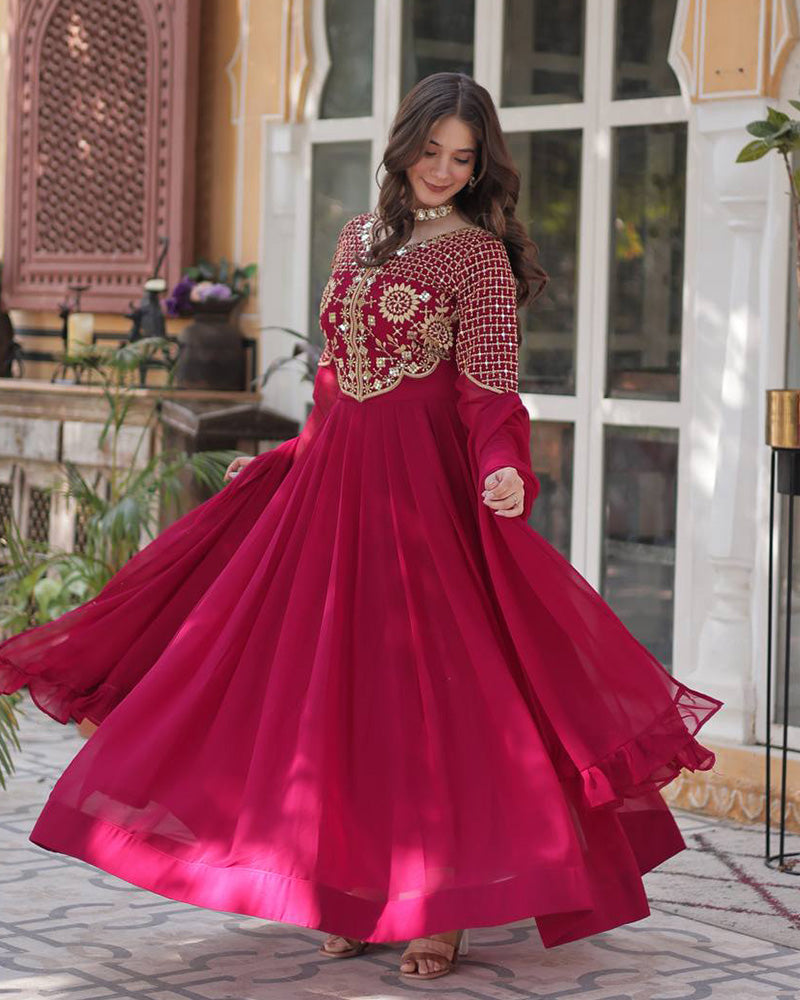 Rani pink color faux blooming georgette gown with embroidered dupatta