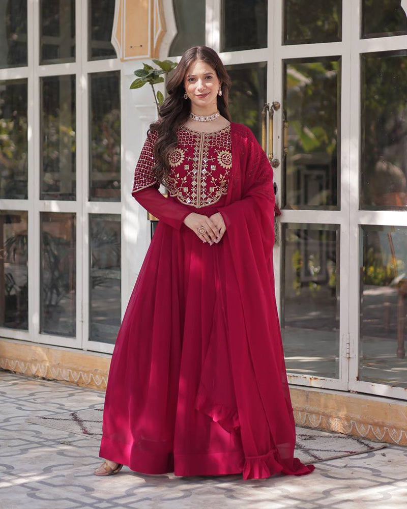 Rani pink color faux blooming georgette gown with embroidered dupatta