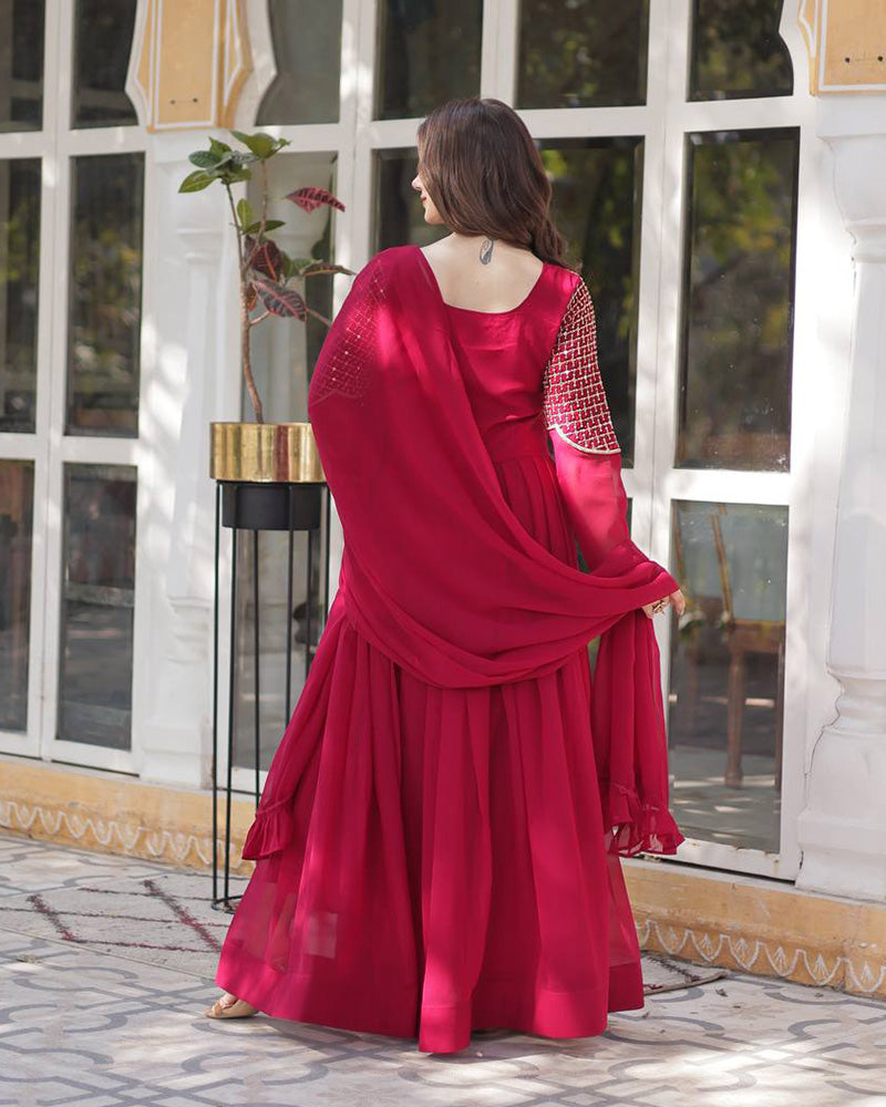 Rani pink color faux blooming georgette gown with embroidered dupatta