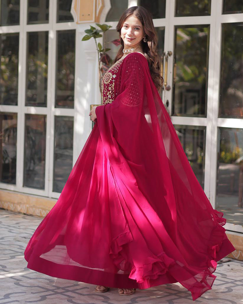Rani pink color faux blooming georgette gown with embroidered dupatta