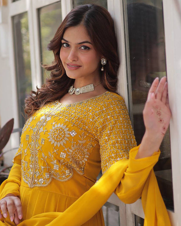 Yellow color faux blooming georgette gown with embroidered dupatta