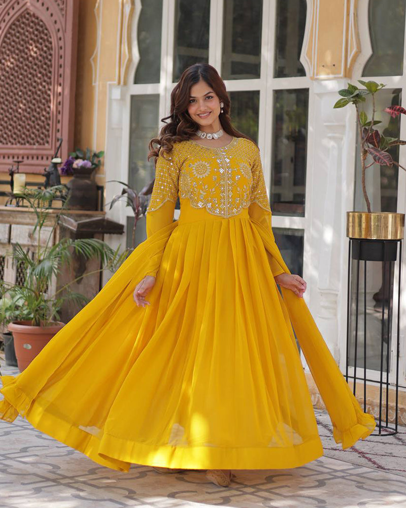 Yellow color faux blooming georgette gown with embroidered dupatta
