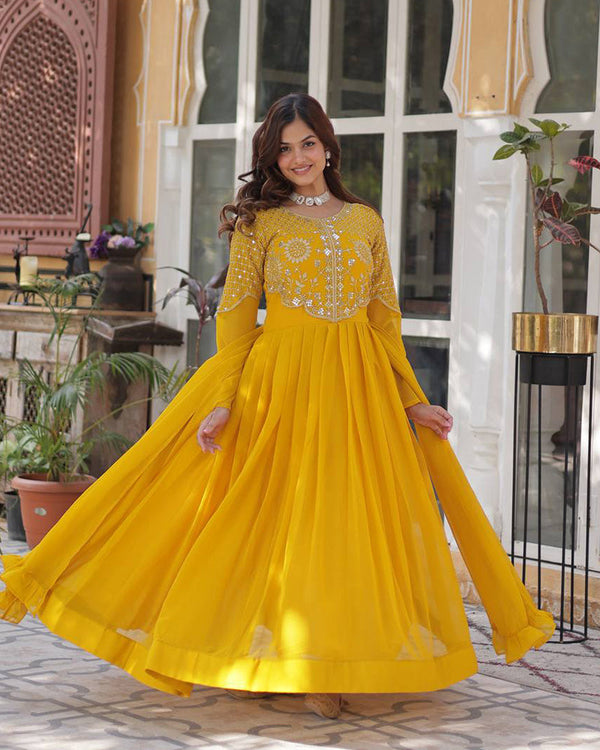 Yellow color faux blooming georgette gown with embroidered dupatta