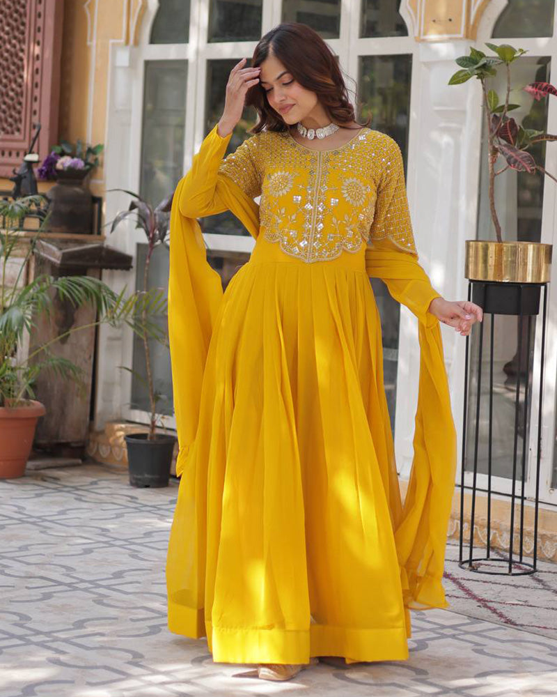 Yellow color faux blooming georgette gown with embroidered dupatta