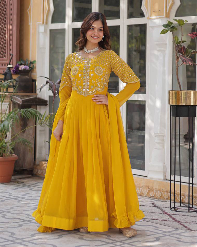 Yellow color faux blooming georgette gown with embroidered dupatta