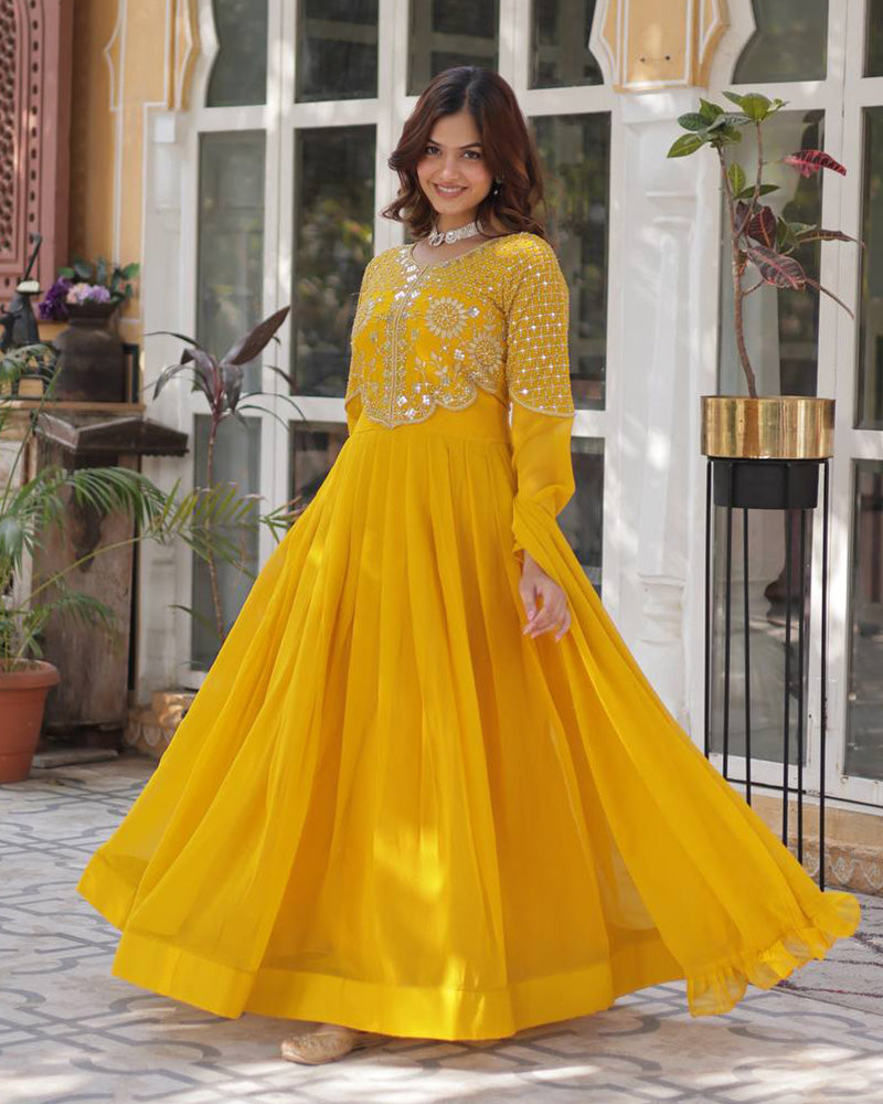 Yellow color faux blooming georgette gown with embroidered dupatta