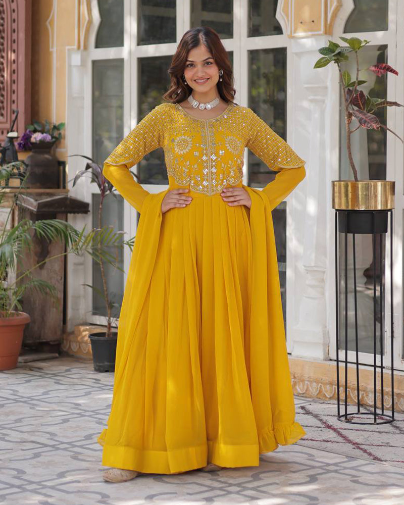 Yellow color faux blooming georgette gown with embroidered dupatta