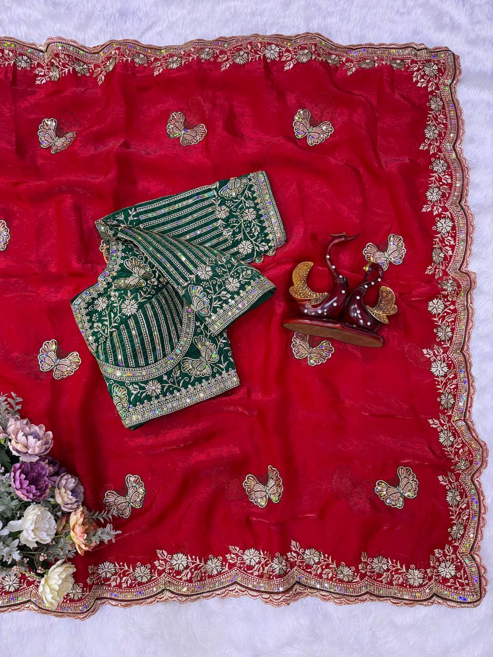 Red Fandy Silk Saree Featuring Butterfly Motifs & Green Embroidered Blouse