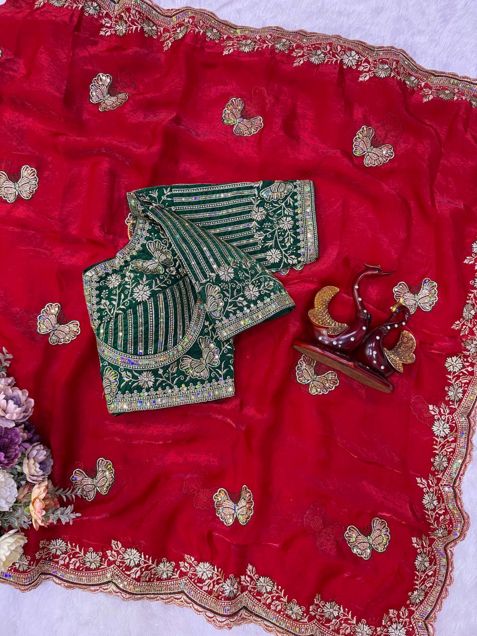 Red Fandy Silk Saree Featuring Butterfly Motifs & Green Embroidered Blouse