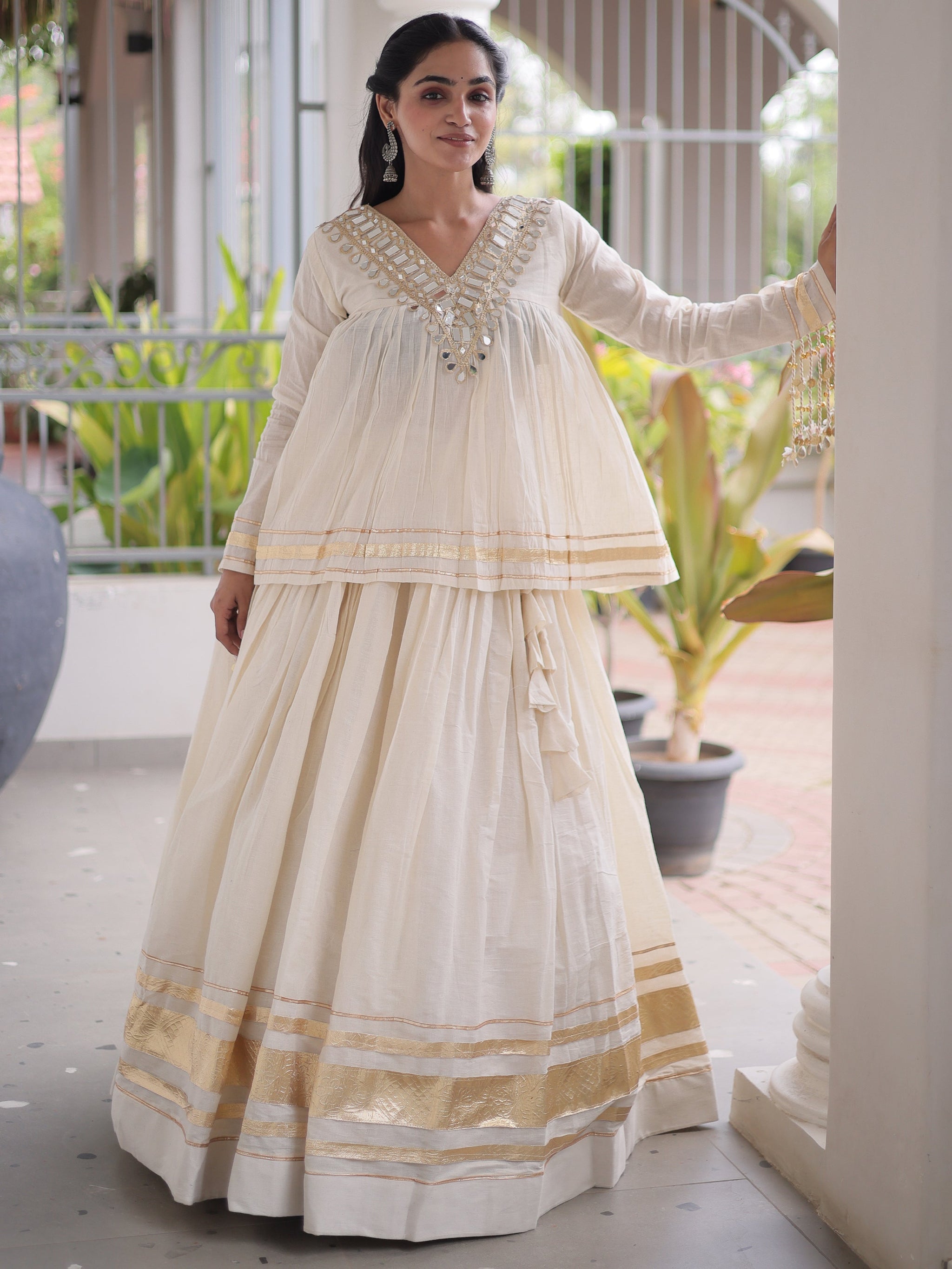 Alluring White Mirror Laced Navratri Wear Lehenga With Peplum Top