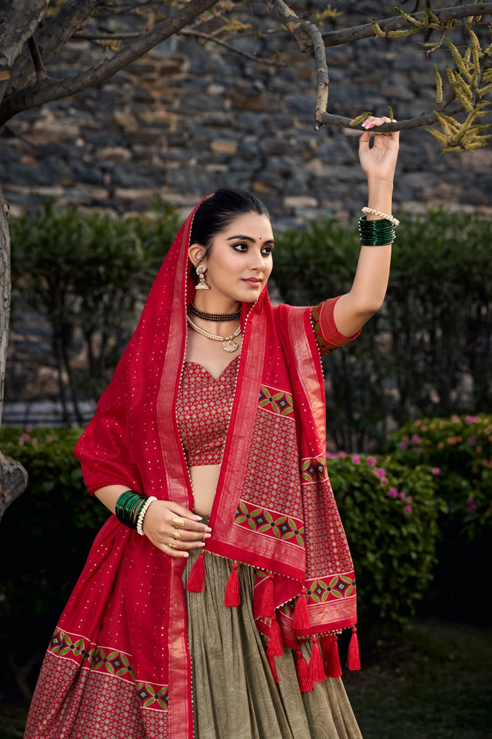 Luxuriant Mehndi And Red Color Foil Print Lehenga Choli